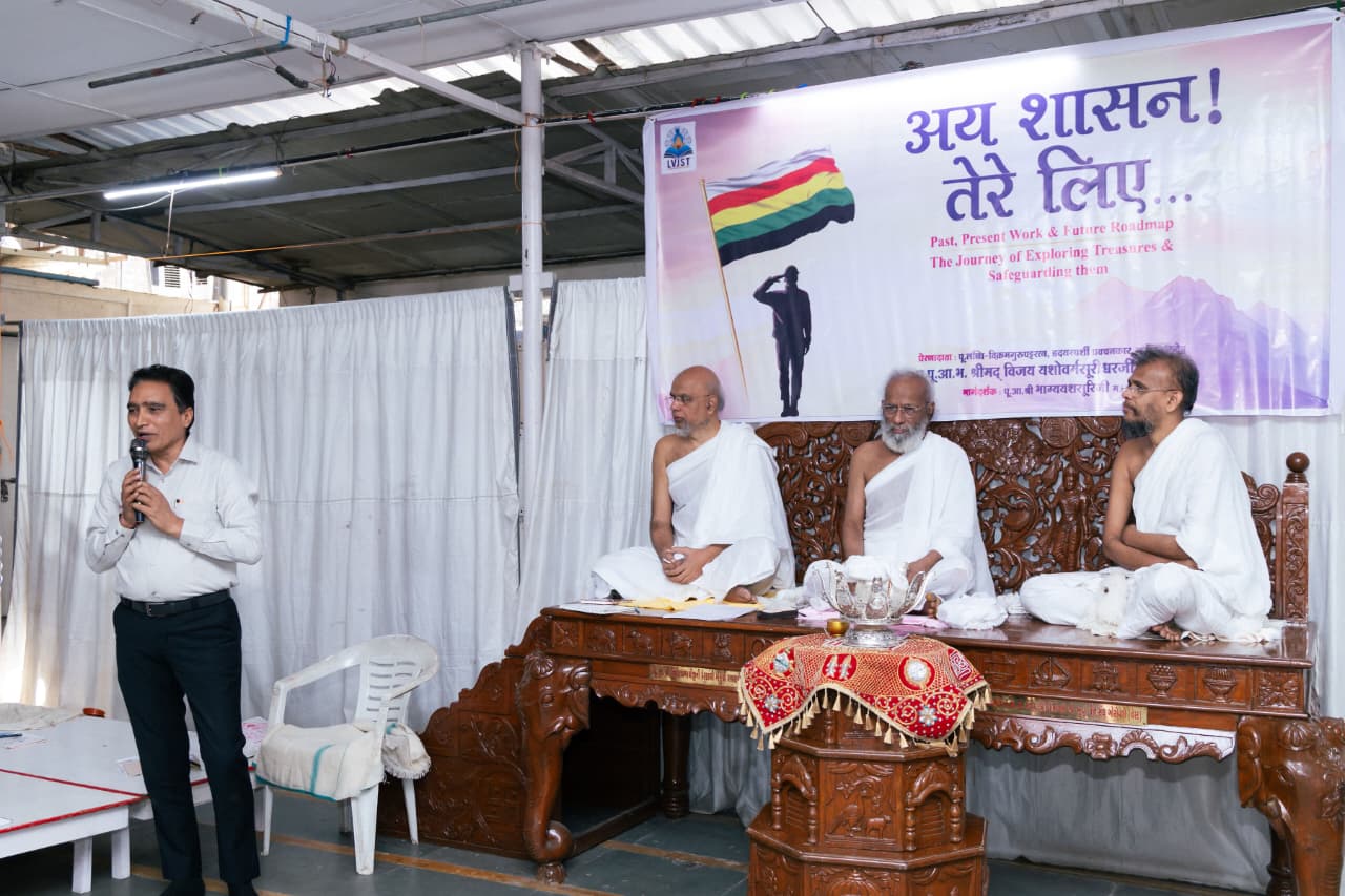 A speaker with Jain monks at the Grand LVJST Meet
